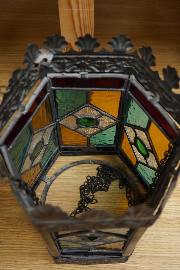 A Victorian coloured stained glass and brass six sided lantern, 31cm high x width 22cm. Condition - glass good, one clip on frame for glass missing